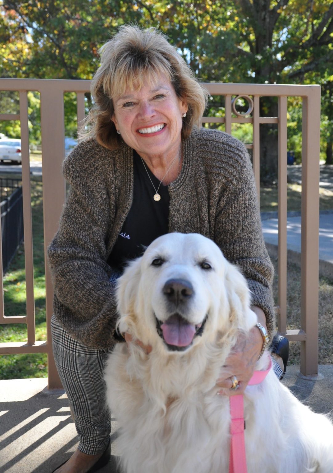 Lois Cousins and Seda, a cream Golden Retriever pass their certification