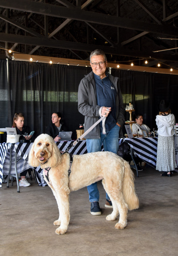 Large golden doodle and WAGS owner Jim before the event. Both look confident.