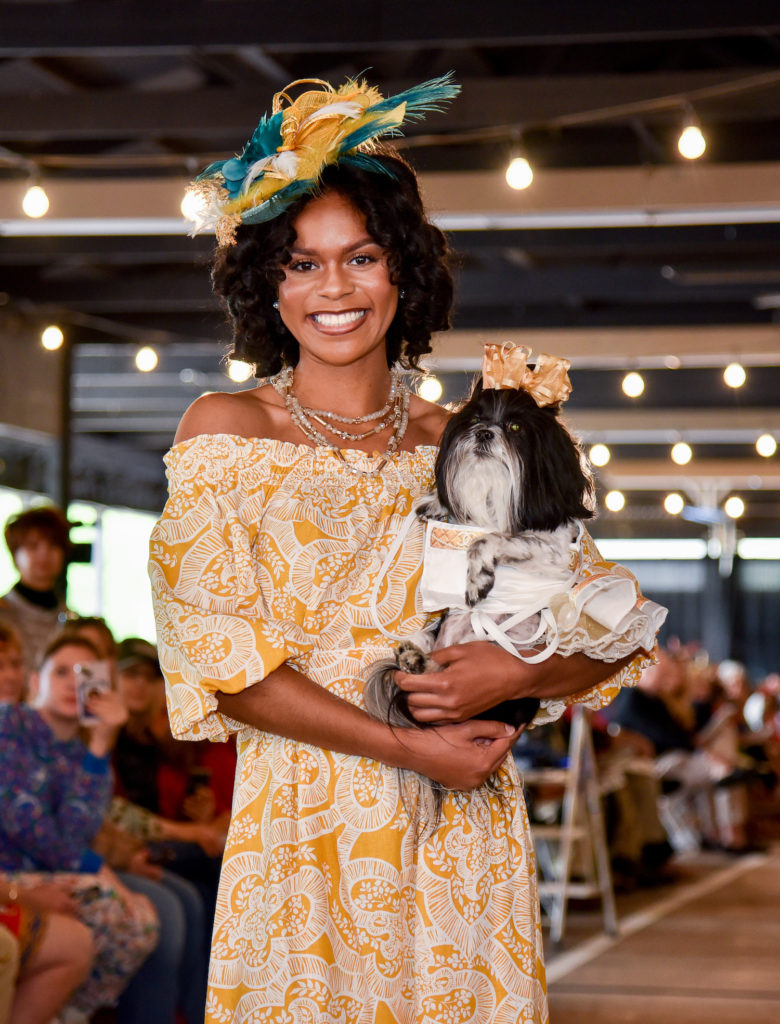 Hats and ribbons, smiles and yellow sundress with WAGS embraced pet